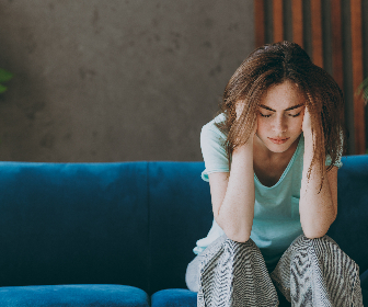 Woman suffering rom Cervicogenic Headaches